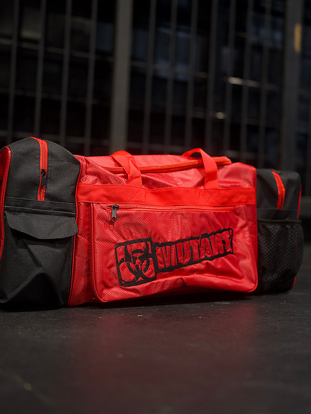 MUTANT® BORN HARDCORE Duffle Gym Bag (Red, Black Edge)